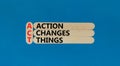 ACT action changes things symbol. Concept words ACT action changes things on wooden sticks on a beautiful blue table blue Royalty Free Stock Photo