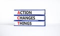 ACT action changes things symbol. Concept words ACT action changes things on books on a beautiful white table white background. Royalty Free Stock Photo