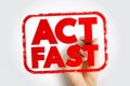 ACT FAST text in bold red stamp style with a hand holding a marker. Concept image for urgency, quick decision making, motivation, Royalty Free Stock Photo