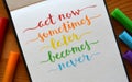 ACT NOW SOMETIMES LATER BECOMES NEVER hand-lettered in notebook Royalty Free Stock Photo
