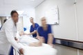 Acting quickly to save lives. A team of doctors rushing a patient down the hallway. Royalty Free Stock Photo