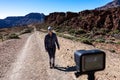 Action camera filming of woman on scenic hiking trail through canyon near Montana Majua in volcano Teide National Park, Tenerife Royalty Free Stock Photo