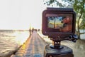 Action camera mounted on a tripod and make a time lapse of the pier and sunrise Royalty Free Stock Photo