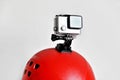 Action camera on red sport helmet Royalty Free Stock Photo