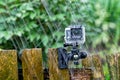 Action camera under heavy rain on nature background