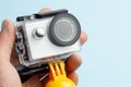 Action camera in a waterproof box and a buoy for diving in hand