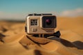 Action camera in waterproof case in sand Royalty Free Stock Photo