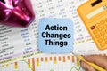 Action Changes Things ACT text on a magnifying glass and on an open notepad Royalty Free Stock Photo