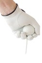 Action of golfer hand in white glove and the golf ball with tee Royalty Free Stock Photo