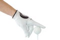Action of golfer hand in white glove and the golf ball with tee Royalty Free Stock Photo