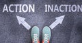 Action and inaction as different choices in life - pictured as words Action, inaction on a road to symbolize making decision and