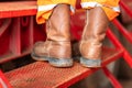 Action of an industrial worker with safety shoe  is walking up. Royalty Free Stock Photo