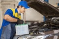 Action of man hands using spanner remove car battery terminals to change the new one