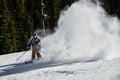 Action photo of skier downhill on fresh powder snow
