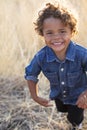 Action photo of a Smiling and active little African American little boy