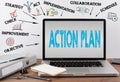 Action Plan concept. Office desk with a laptop Royalty Free Stock Photo