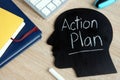 Action plan written on head silhouette