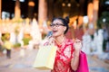 Action portrait beautiful Asian girl wearing Cheongsam red dress. Royalty Free Stock Photo