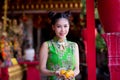 Action portrait beautiful Asian girl wearing Cheongsam red dress. Royalty Free Stock Photo
