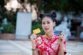 Action portrait beautiful Asian girl wearing Cheongsam red dress. Royalty Free Stock Photo