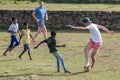 Sri Lankan boys play football with foreign men inside the old Dutch Fort at Galle in Sri Lanka.