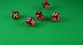 An Action shot of 5 dice thrown onto the table Royalty Free Stock Photo