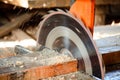 action shot of a circular saw held at an angle, slicing through timber Royalty Free Stock Photo