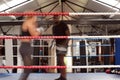 Action Shot Of Male Personal Trainer Sparring With Female Boxer In Gym Using Training Gloves Royalty Free Stock Photo