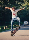 Action shot of a skateboarder skating, doing tricks and jumping