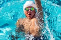 Action shot from top of boy swimming backstroke. Royalty Free Stock Photo