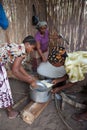 Action shot of women preparing rice of a lunch meal for misison workers