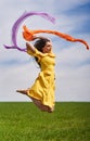 Young woman jumping for joy on a wheat field Royalty Free Stock Photo