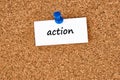 Action. Word written on a piece of paper, cork board background Royalty Free Stock Photo