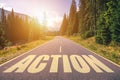 Action word written on road in the mountains Royalty Free Stock Photo