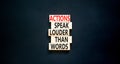 Actions speak louder words symbol. Concept words Actions speak louder than words on wooden blocks. Beautiful black table black Royalty Free Stock Photo