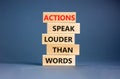 Actions speak louder words symbol. Concept words Actions speak louder than words on wooden blocks. Beautiful grey table grey Royalty Free Stock Photo