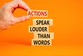 Actions speak louder words symbol. Concept words Actions speak louder than words on wooden blocks. Beautiful orange table orange Royalty Free Stock Photo