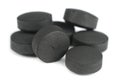 Activated Carbon (Activated Charcoal) Pills on White Background
