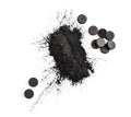 Activated charcoal in powder and in pills Royalty Free Stock Photo