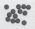 Activated Charcoal Tablets For Cleansing The Body On A Gray Background Royalty Free Stock Photo