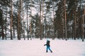 Active Adult Caucasian Woman Have Fun Are Skiing In Winter Snowy Forest. Active Healthy Lifestyle On Winter Nature