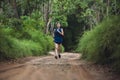 Active Asian woman trail runner running in park outdoor Royalty Free Stock Photo