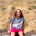 Tomboy Girl Smiling covered in Sweat after Exercise Hiker