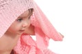 Active baby under a pink blanket