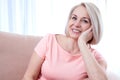 Active beautiful middle-aged woman smiling friendly and looking into the camera. Woman's face close up. Royalty Free Stock Photo