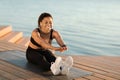 Active black woman doing stretching workout on the beach Royalty Free Stock Photo