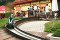 Active boy is going down in bobsleigh in the Lipno.