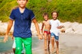Active boys running one after another on the beach Royalty Free Stock Photo