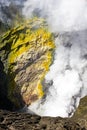 Active Bromo volcano mountain crater hole erupt with sulfur gas and smoke at Indonesia Bromo national park