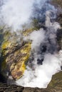 Active Bromo volcano mountain crater hole erupt with sulfur gas and smoke at Indonesia Bromo national park